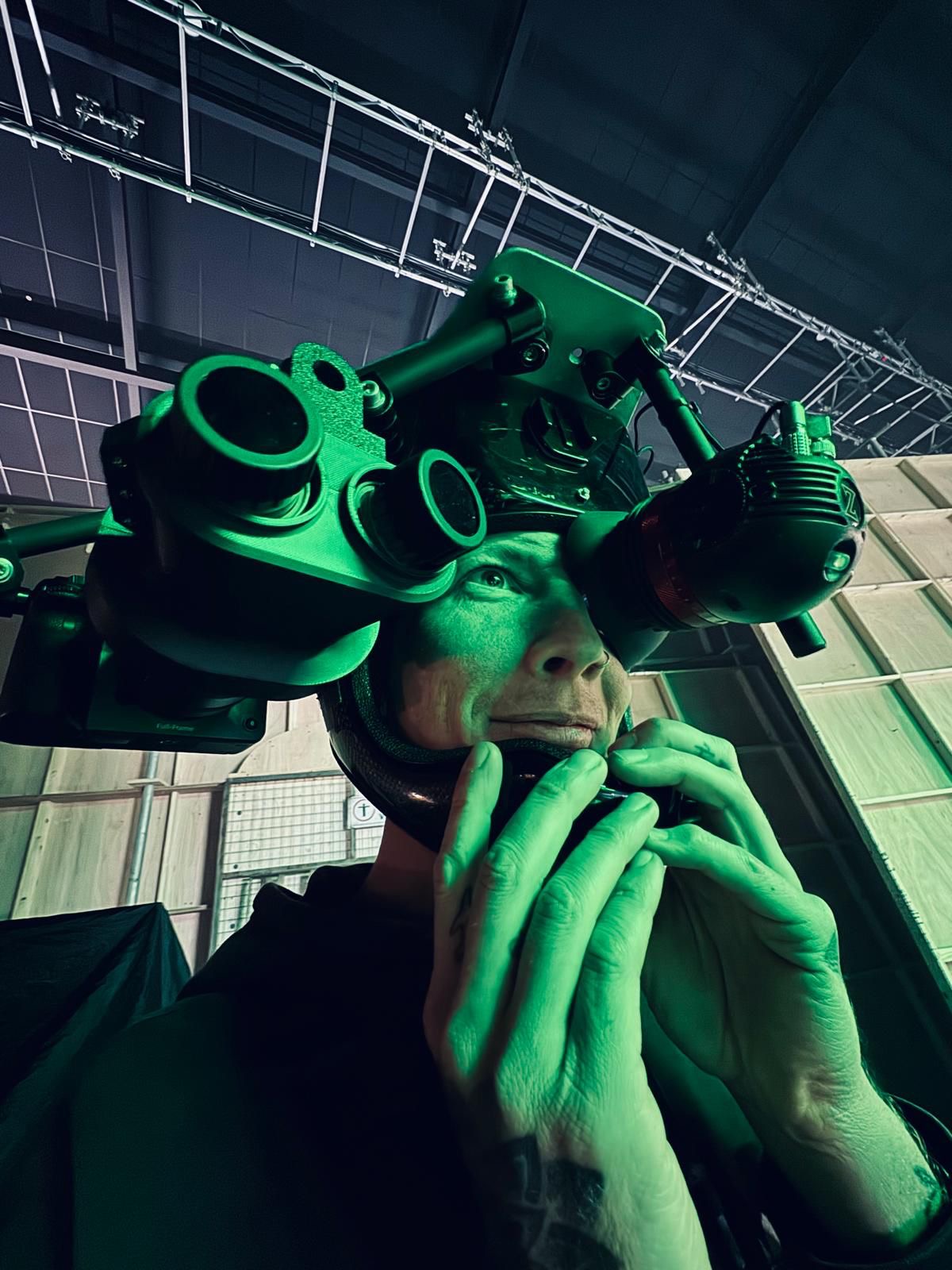 Operator wearing night vision goggles on set
